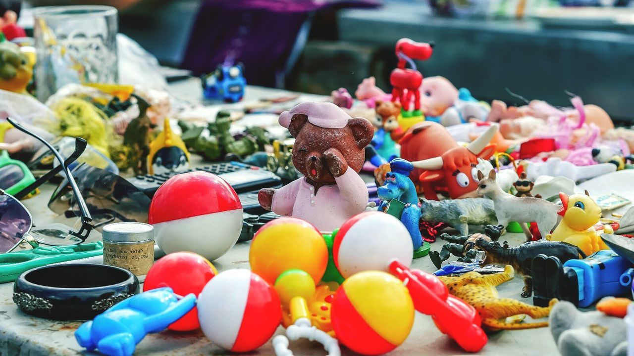 Close-up of multi colored toys for sale in market
