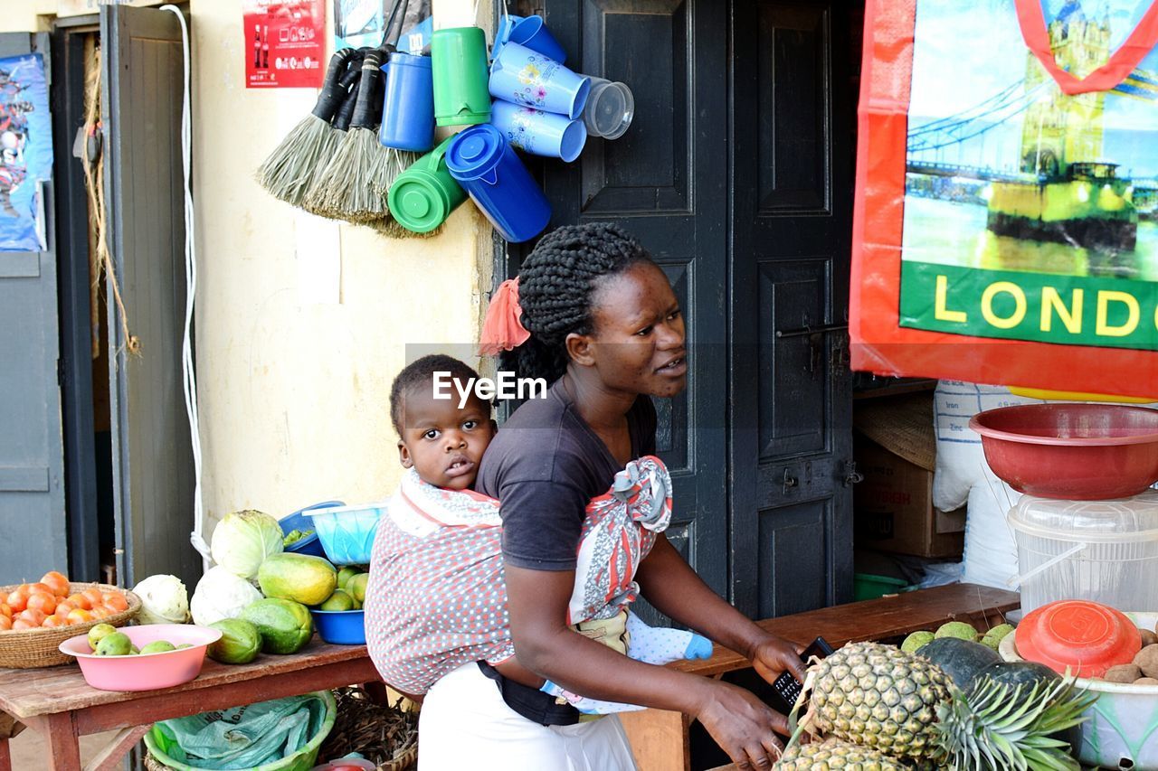 WOMEN SITTING IN A FRUITS