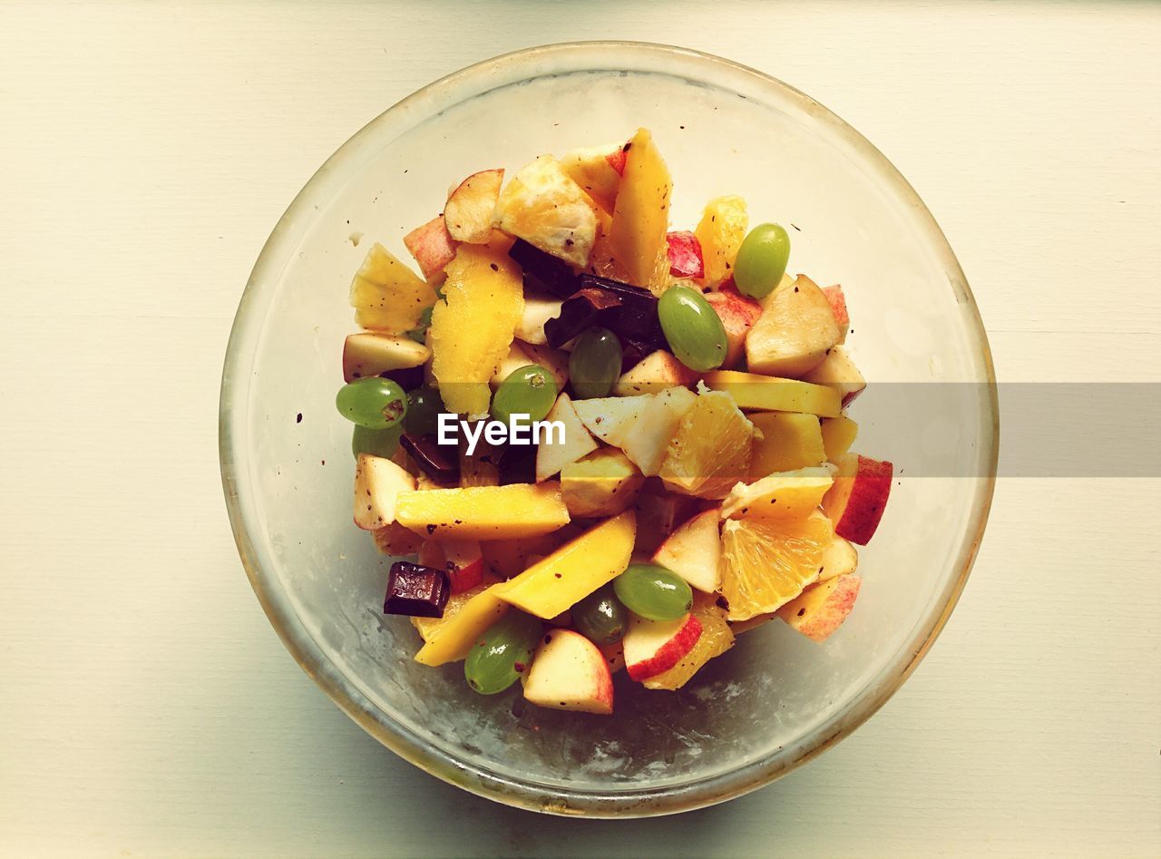 Overhead view of fruit salad in glass bowl