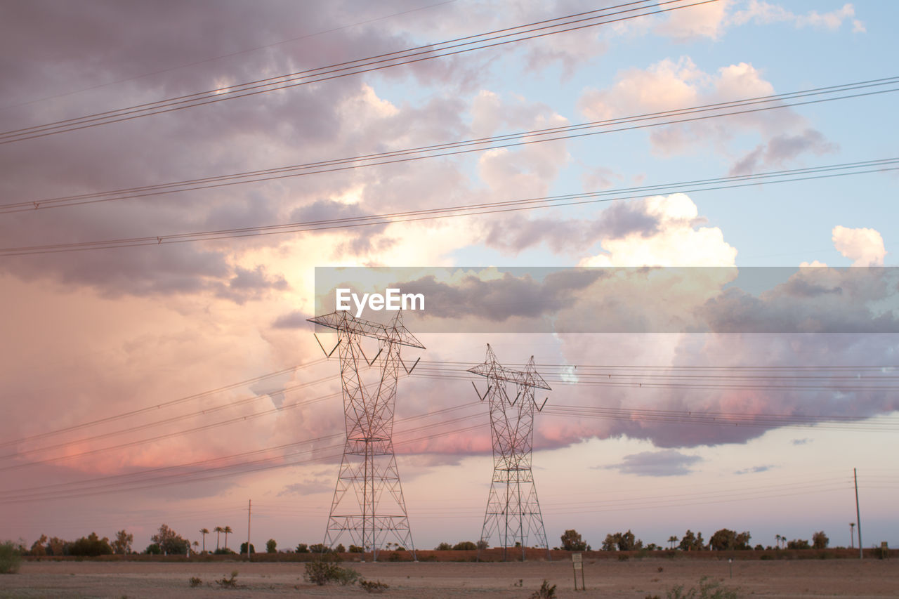 ELECTRICITY PYLON AGAINST SKY