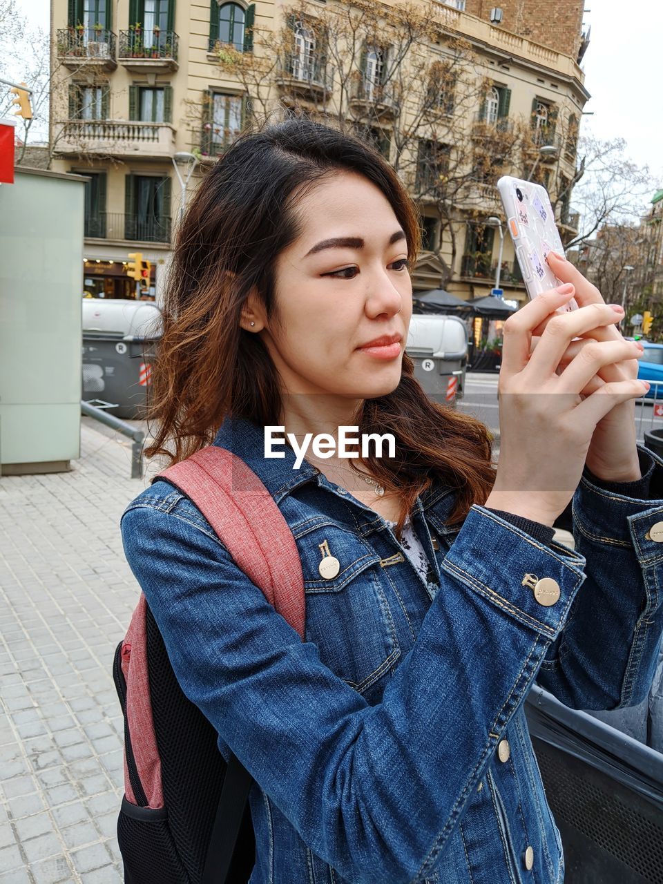 Portrait of beautiful woman standing in city