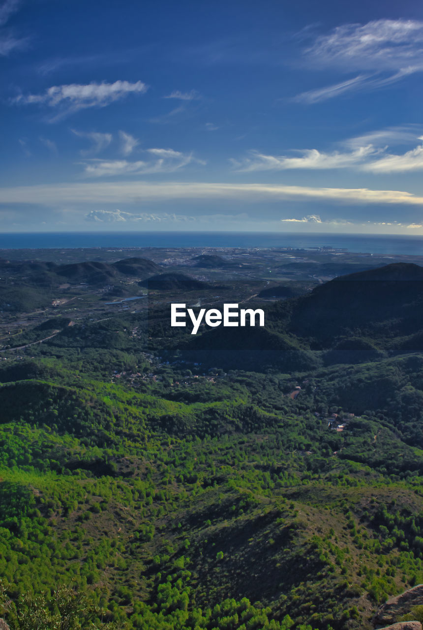 SCENIC VIEW OF GREEN LANDSCAPE AGAINST SKY