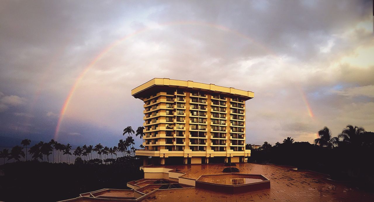 VIEW OF BUILDING AGAINST CLOUDY SKY