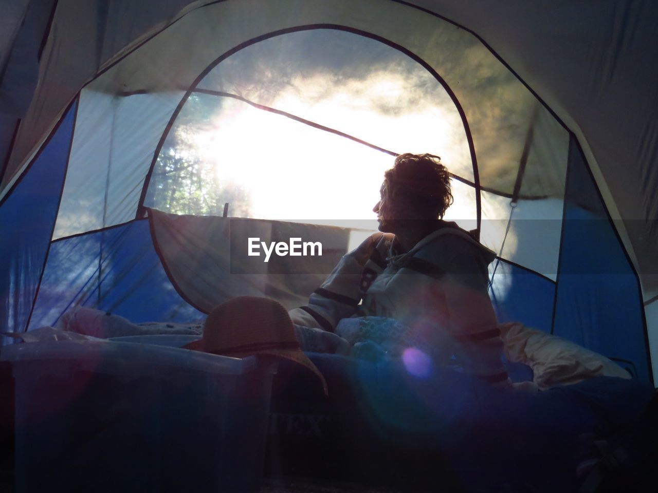 Woman sitting in tent