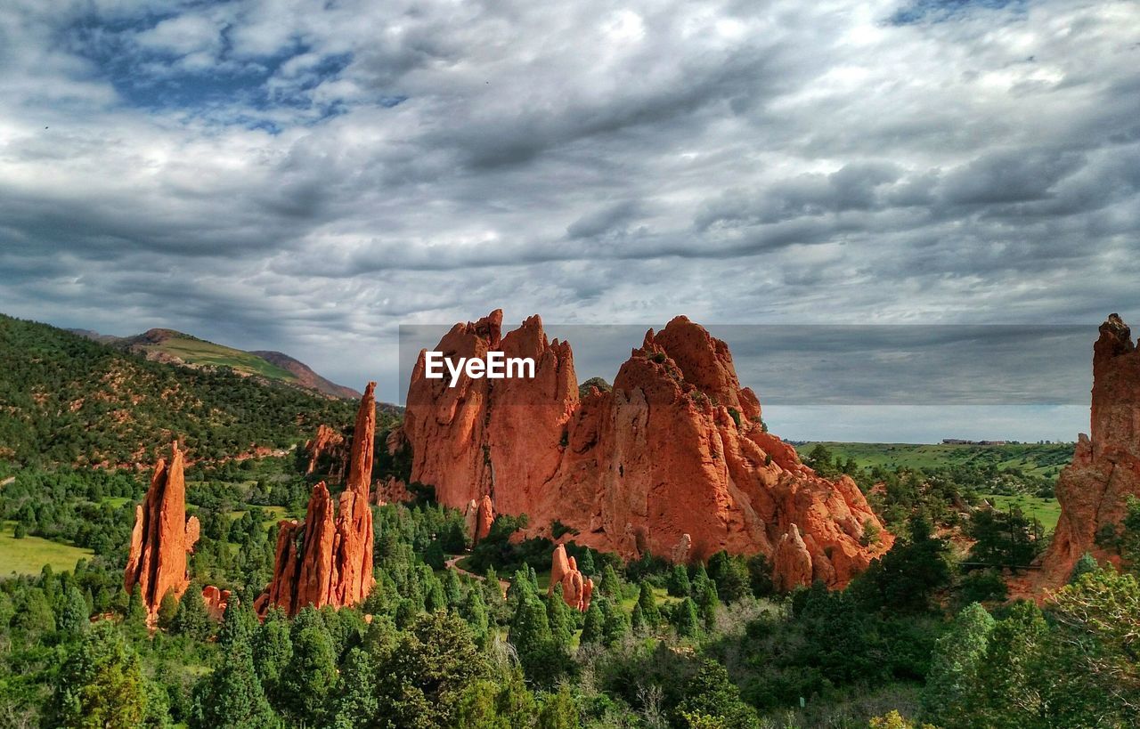 Rock formations at garden of the gods against cloudy sky