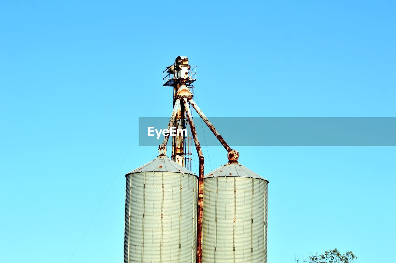 LOW ANGLE VIEW OF SMOKE STACK AGAINST CLEAR SKY