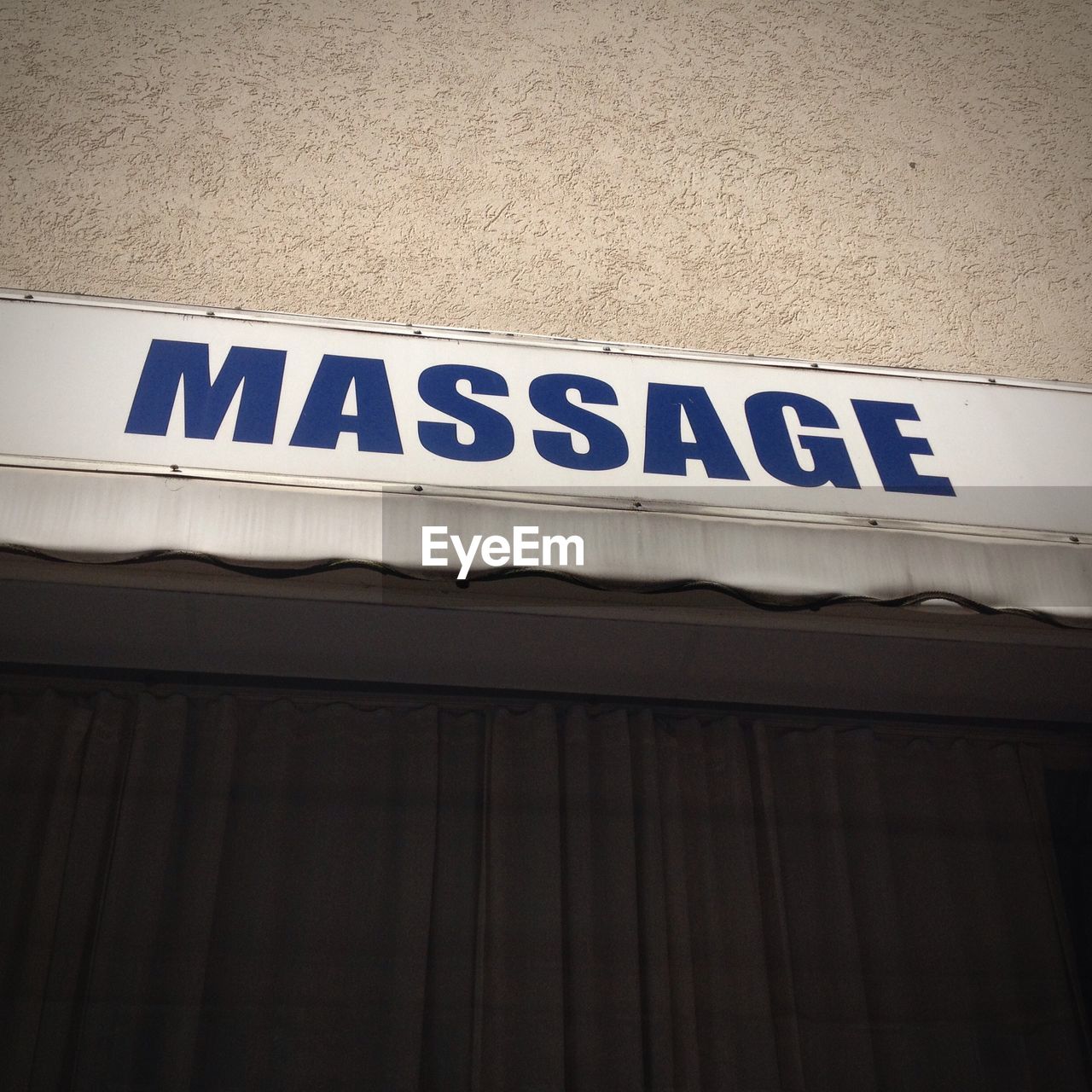 Low angle view of massage text on wall