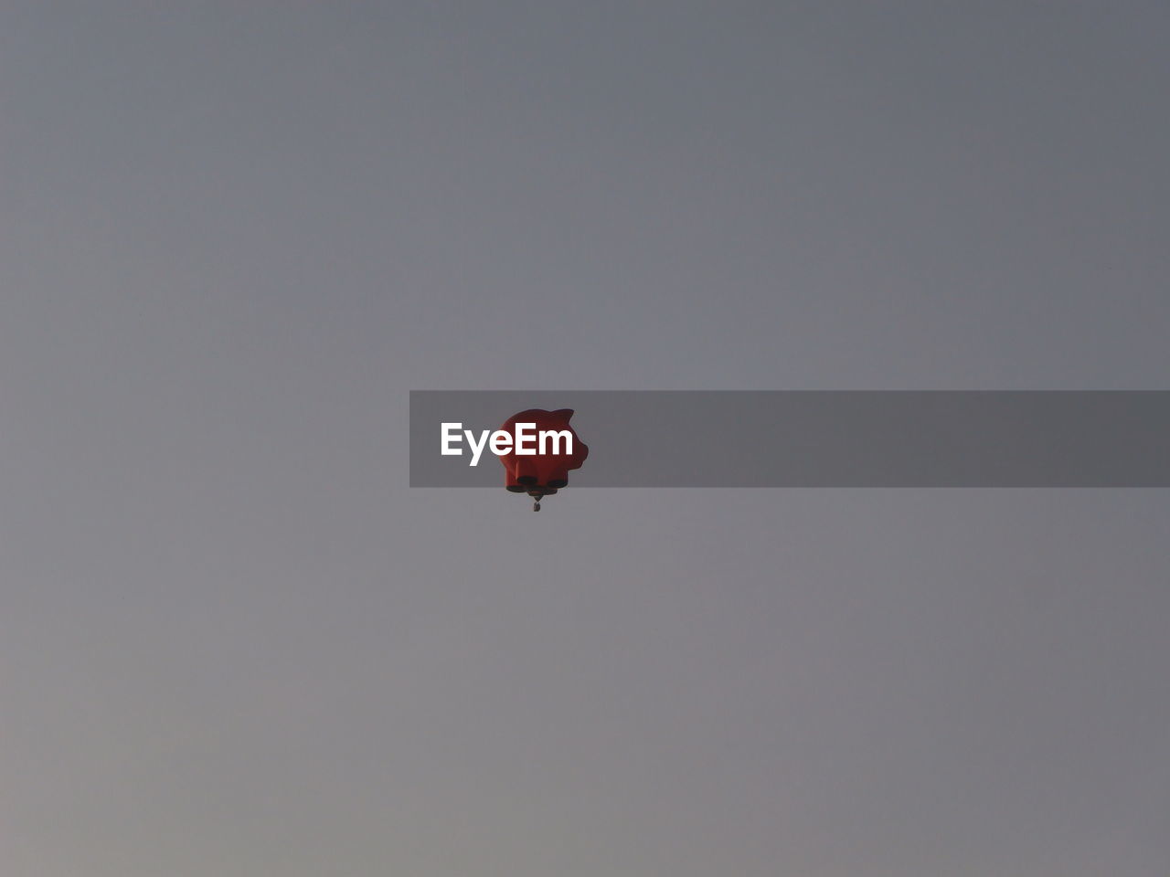 Low angle view of hot air balloon flying in clear sky