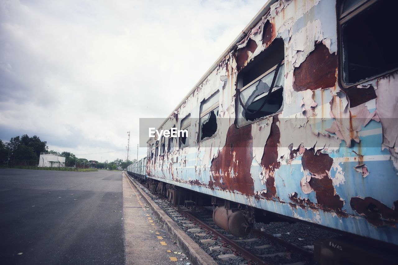 Train on railroad tracks against sky