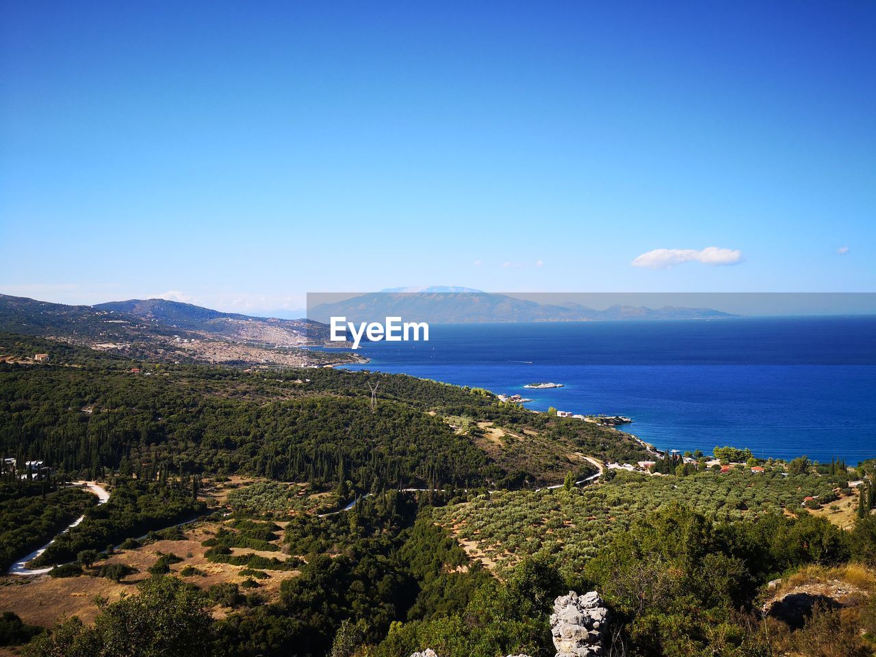 Scenic view of sea against blue sky