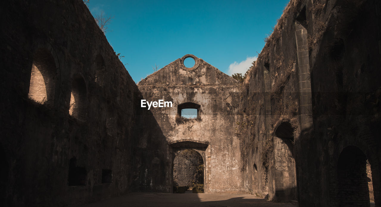 View of old ruin building against sky