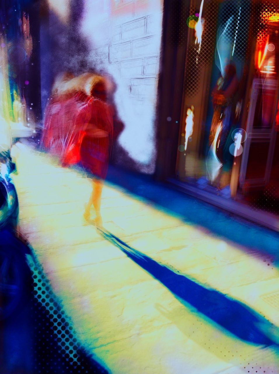 Defocused image of woman walking with shadow on sidewalk