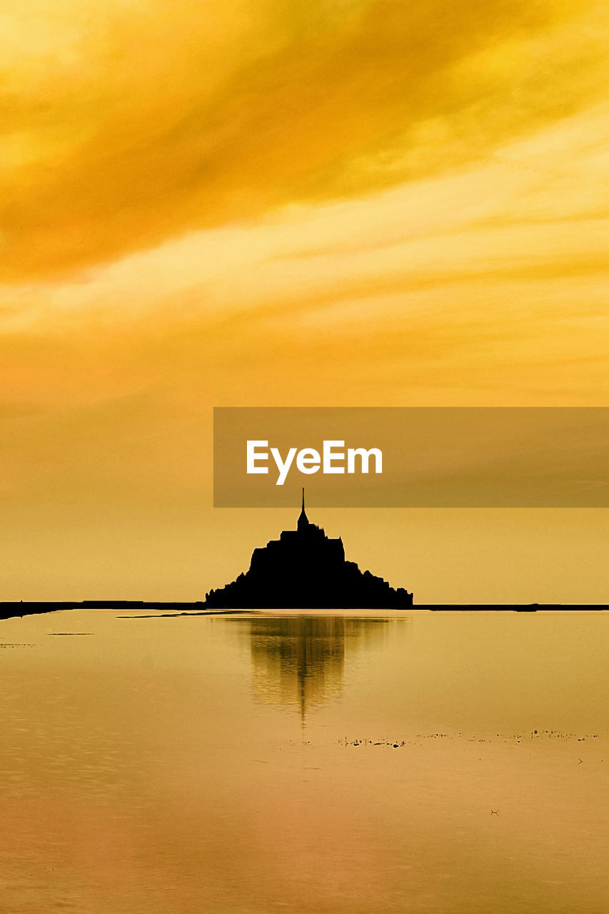 Golden sunrise on mount st michael, normandy