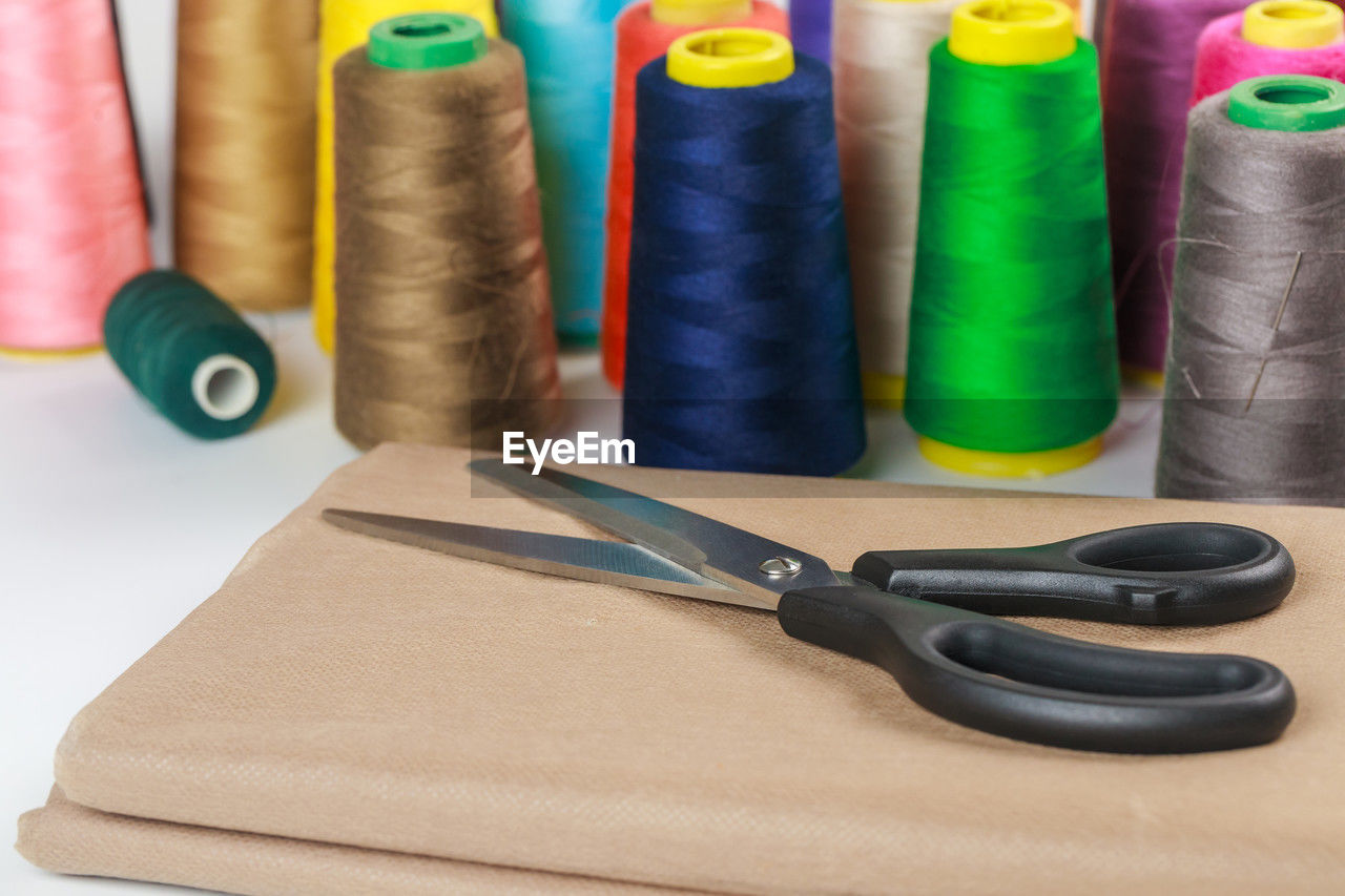 multi colored, scissors, indoors, thread, spool, variation, no people, textile, group of objects, craft, sewing item, still life, large group of objects, creativity, textile industry, close-up, office supplies, industry, material, studio shot, group, art