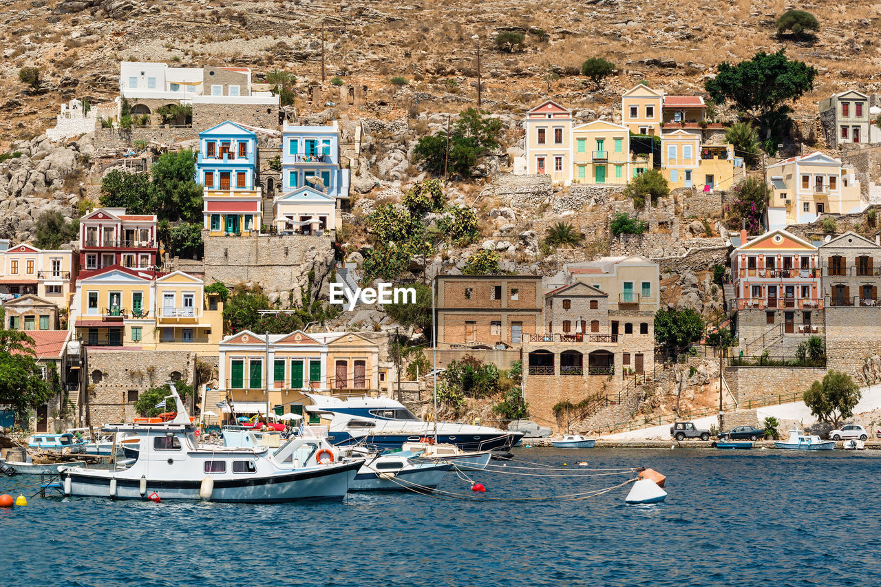 The traditional colorful houses and the port in symi island dodecanese, greece.