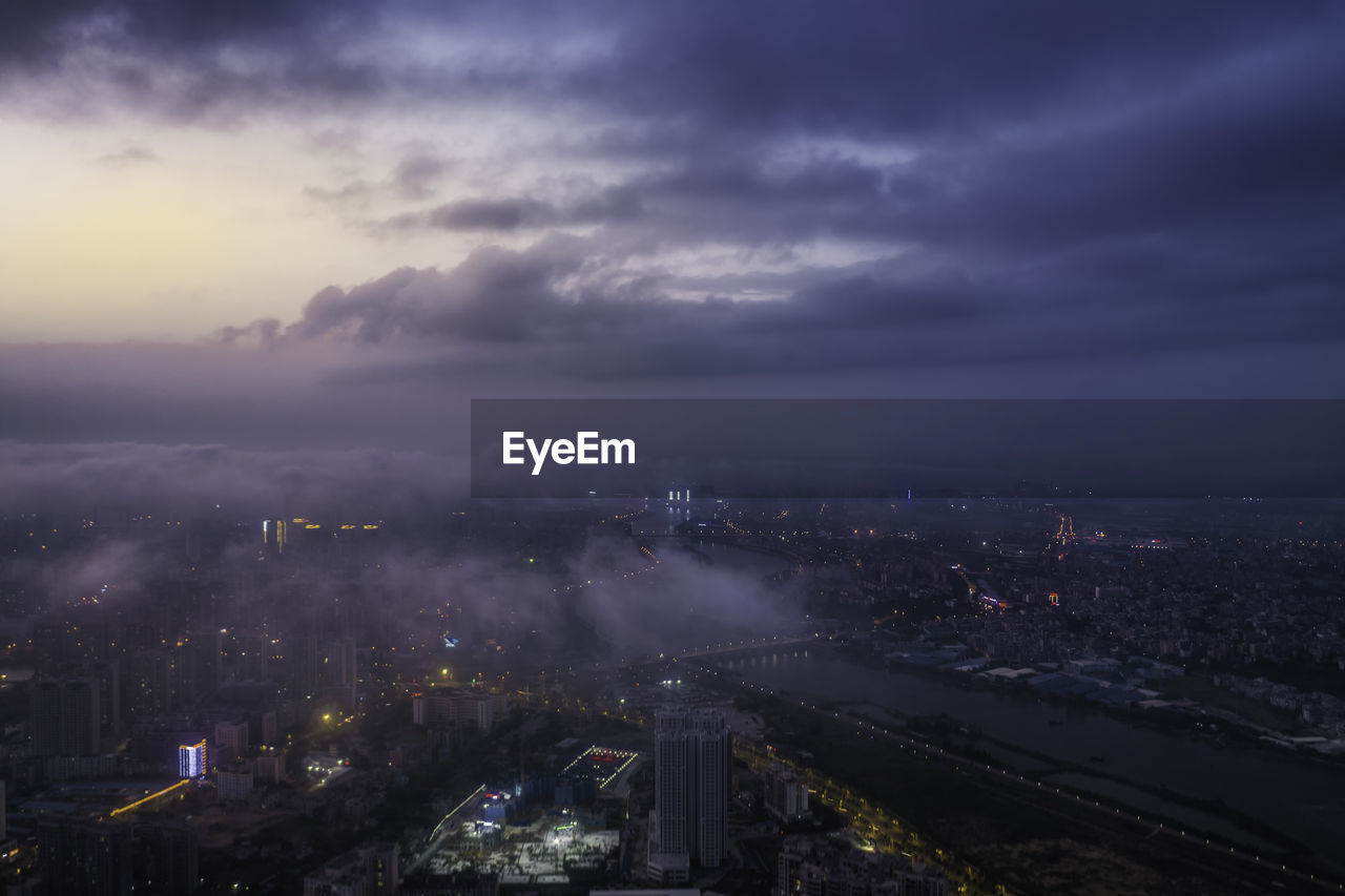 High angle view of illuminated buildings in city at night