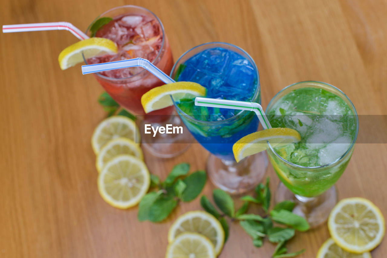 Fruits and colorful drinks on table