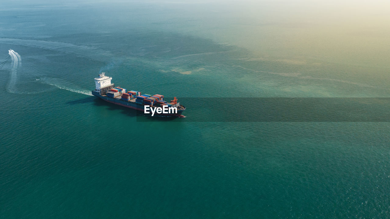 HIGH ANGLE VIEW OF NAUTICAL VESSEL ON SEA