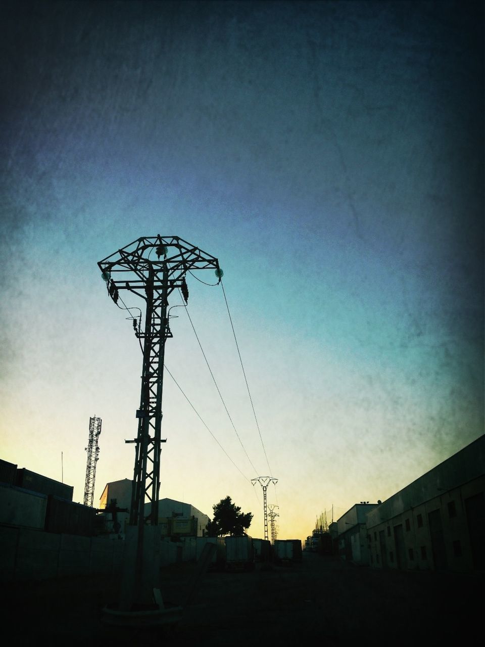 LOW ANGLE VIEW OF ELECTRICITY PYLONS AGAINST SKY