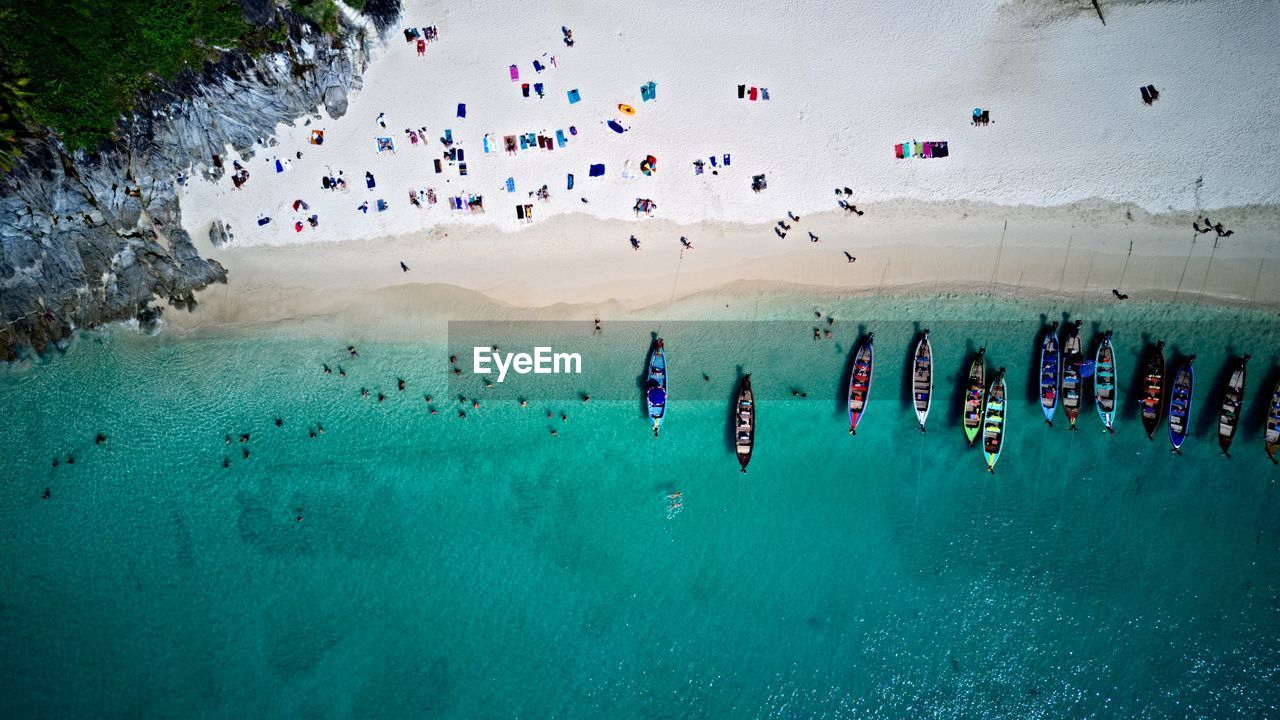 Aerial view of boats and crowd at beach
