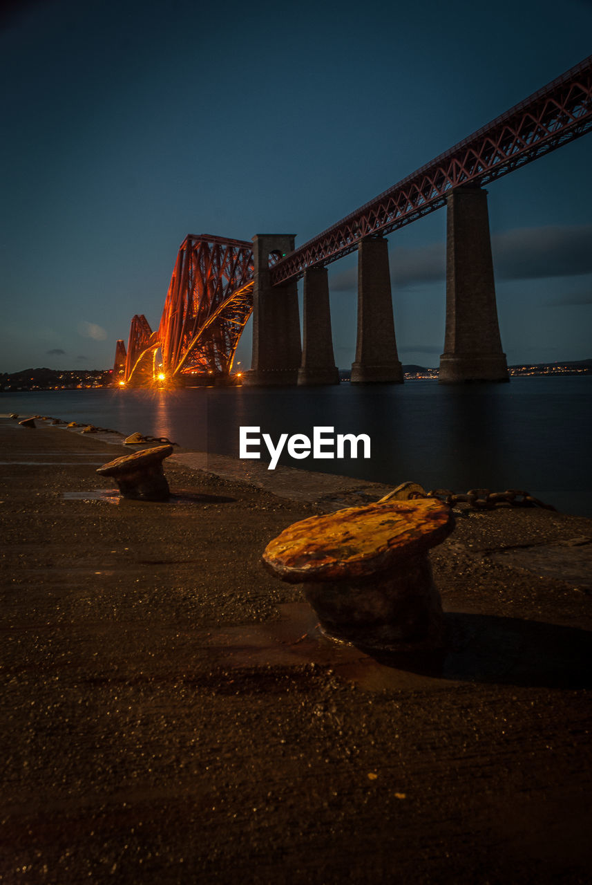 Low angle view of suspension bridge at night