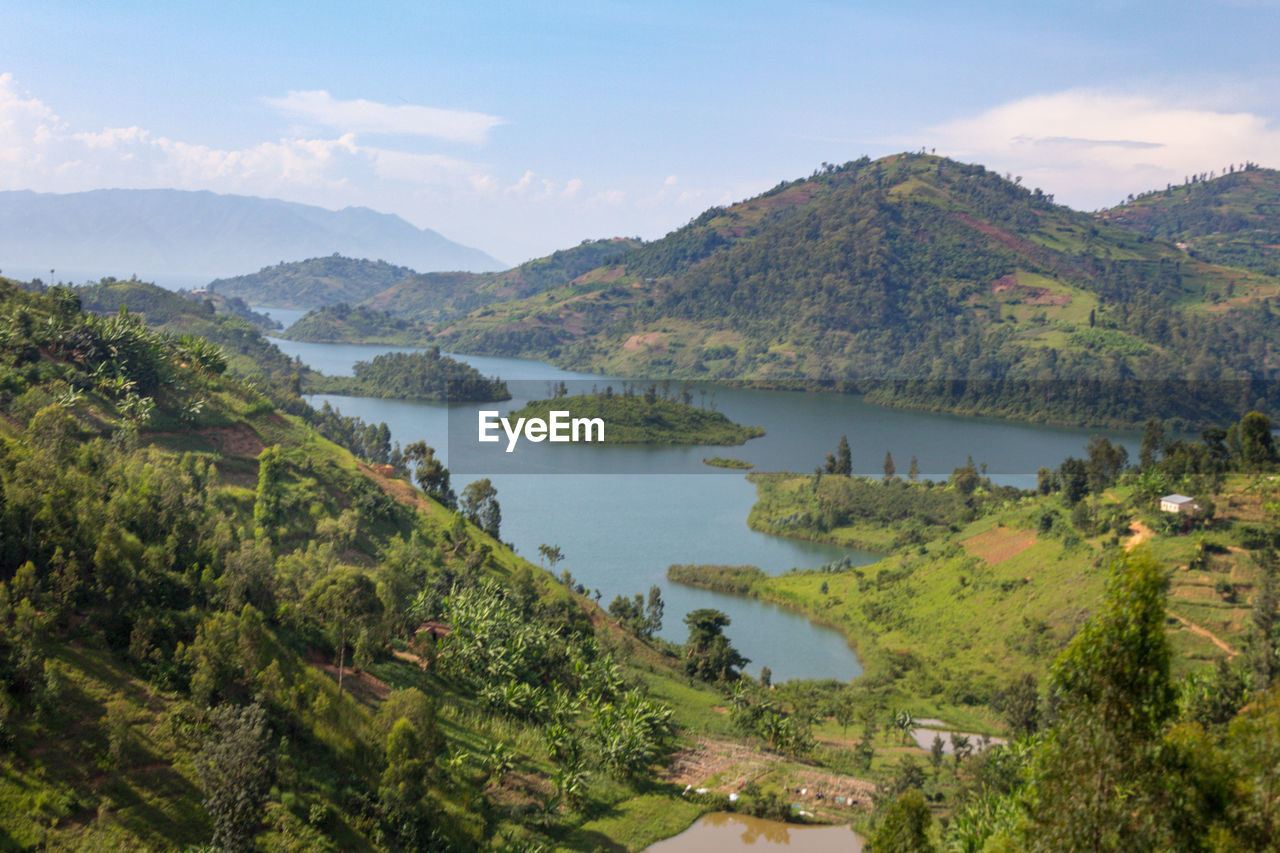 Scenic view of lake and mountains against sky