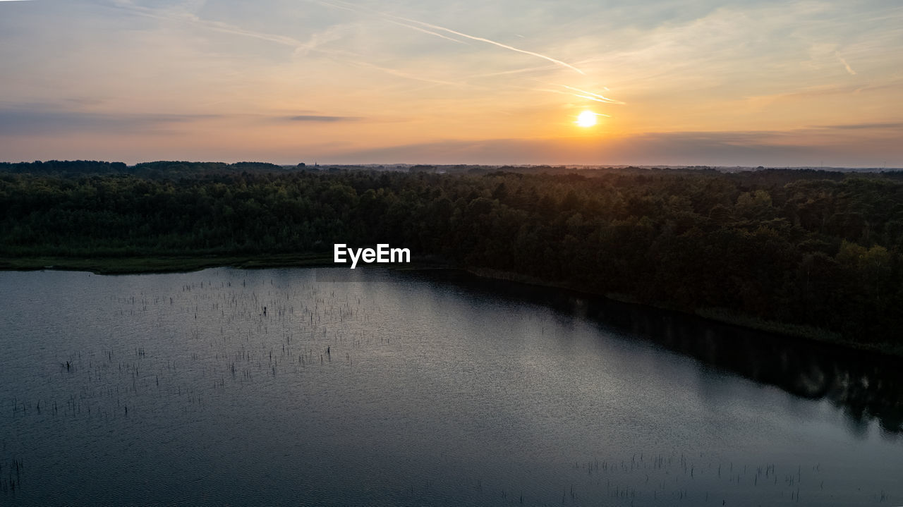 SCENIC VIEW OF LAKE DURING SUNSET