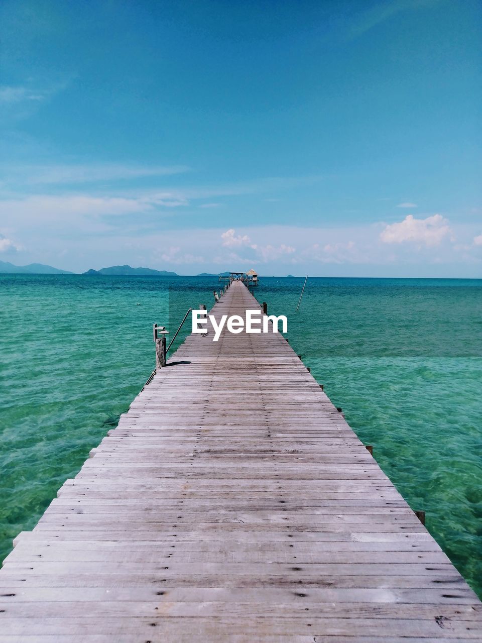 Pier over sea against sky