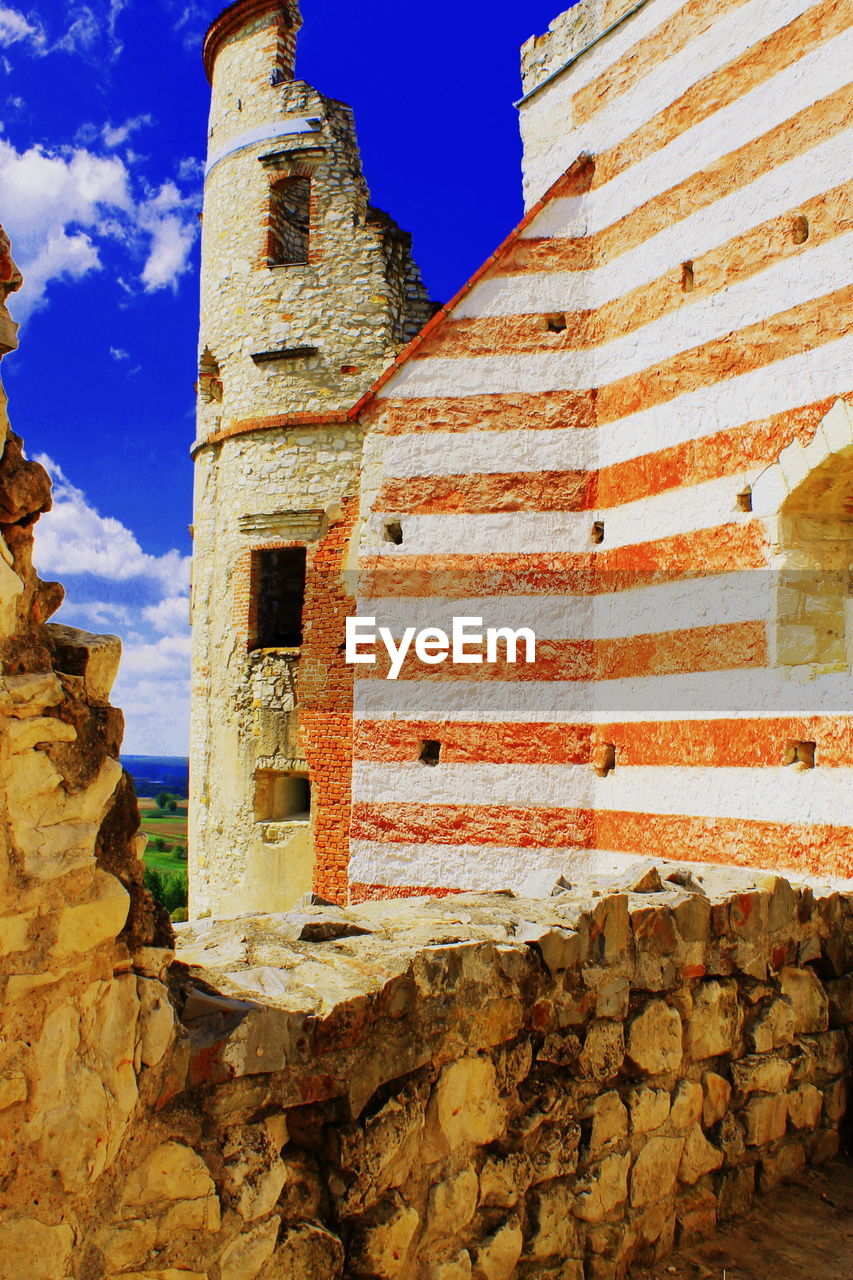 Low angle view of old ruins against sky