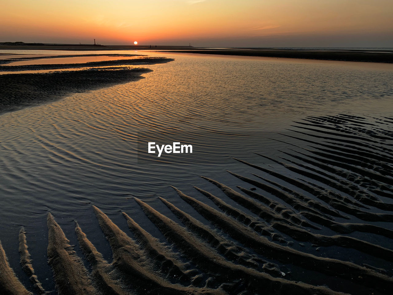 Scenic view of beach during sunset