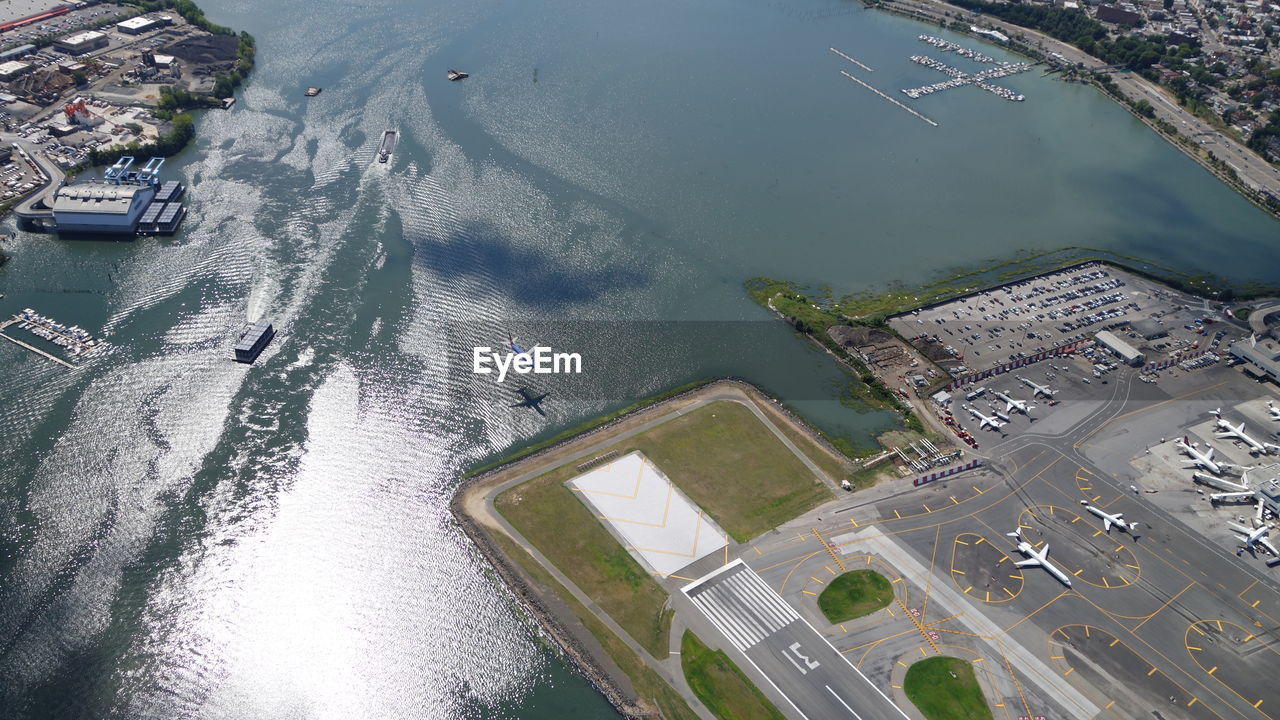 Aerial view of runway by sea