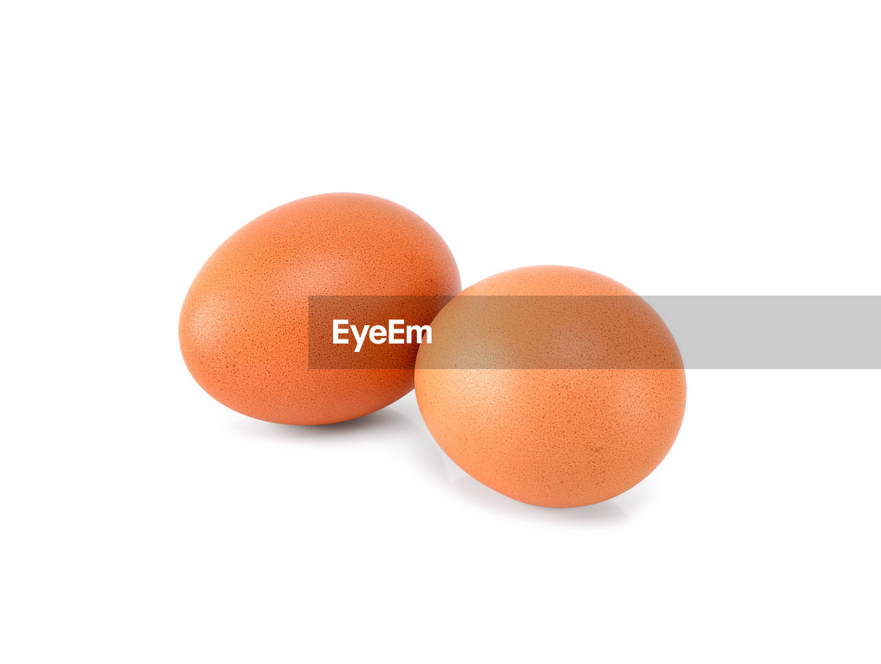 CLOSE-UP OF EGGS ON WHITE BACKGROUND