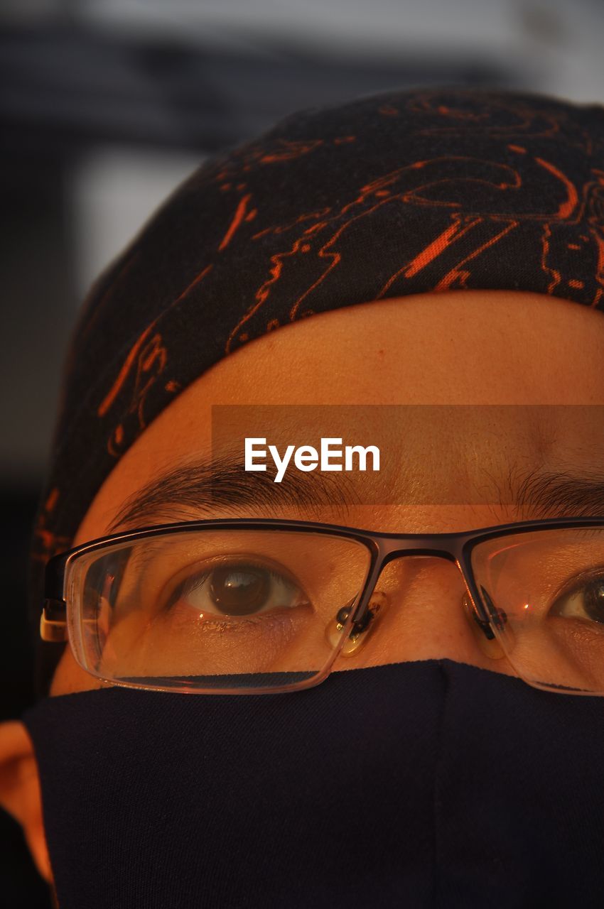 Close-up portrait of man wearing eyeglasses