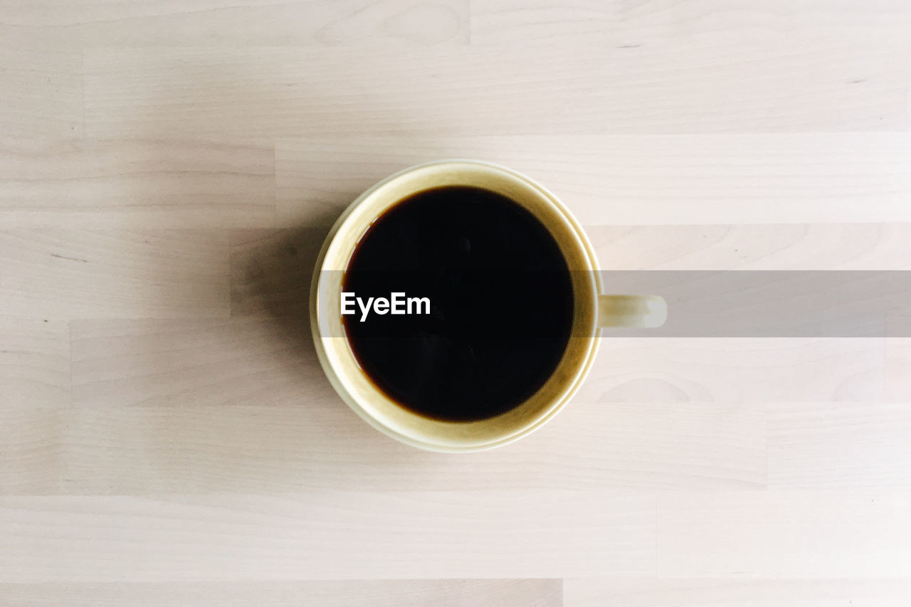 CLOSE-UP OF COFFEE ON TABLE