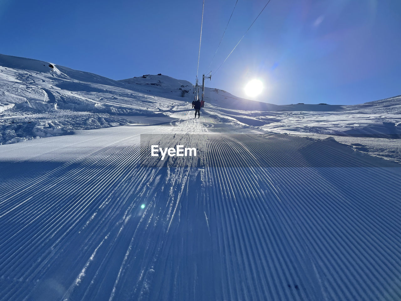 low angle view of snow covered landscape against sky