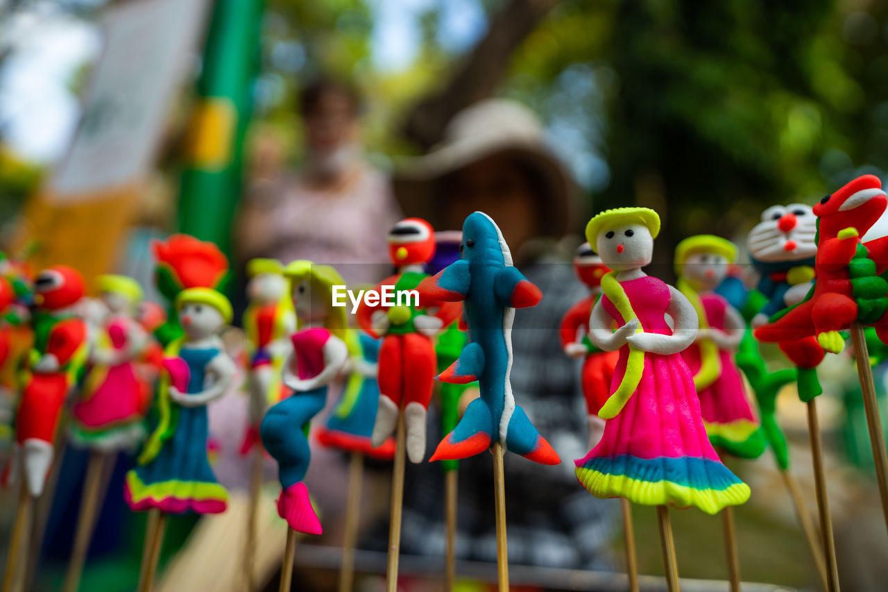 CLOSE-UP OF TOYS FOR SALE AT MARKET