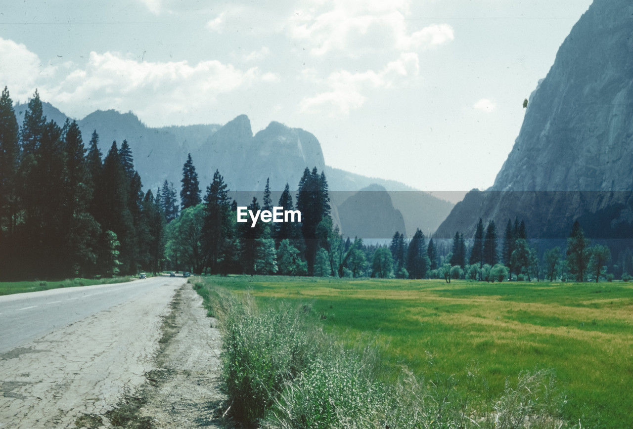 panoramic view of road amidst mountains against sky