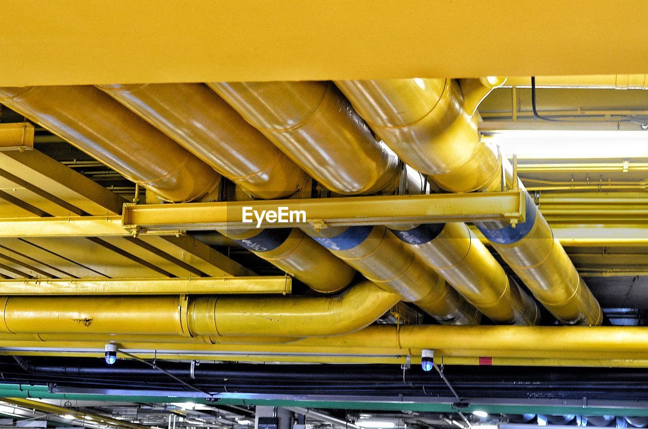 Low angle view of pipes in industry