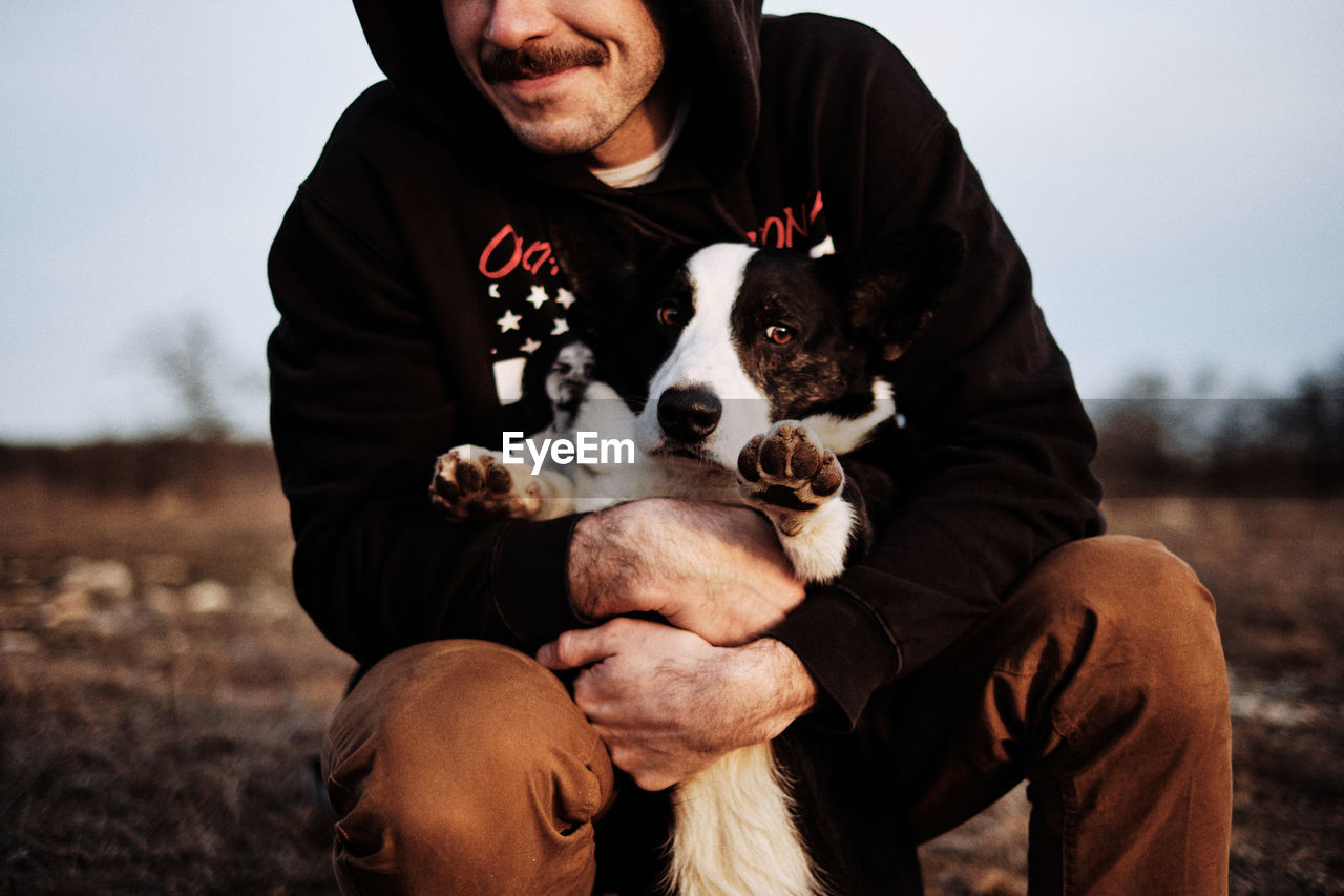 Man hugging a dog