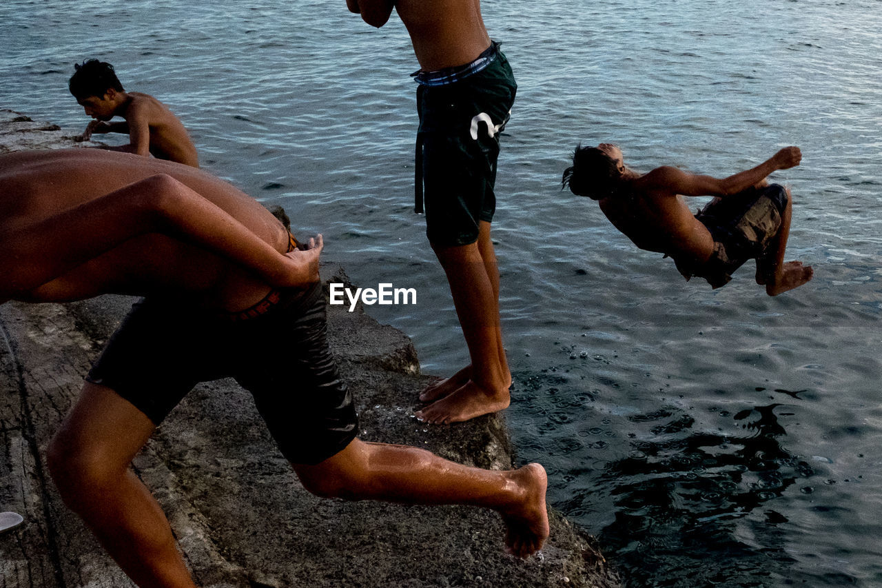 LOW SECTION OF MEN ON BEACH