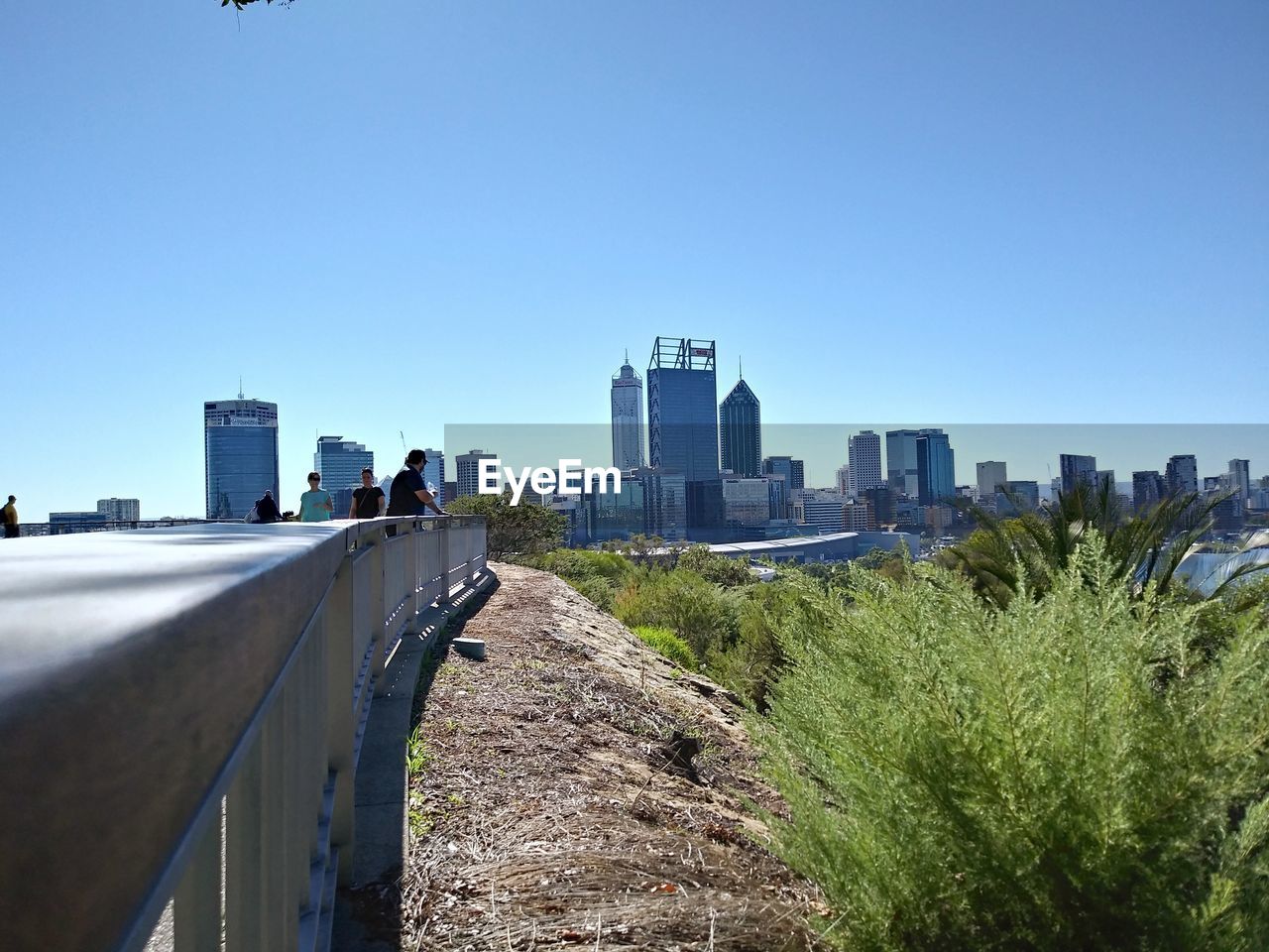 MODERN BUILDINGS AGAINST CLEAR BLUE SKY