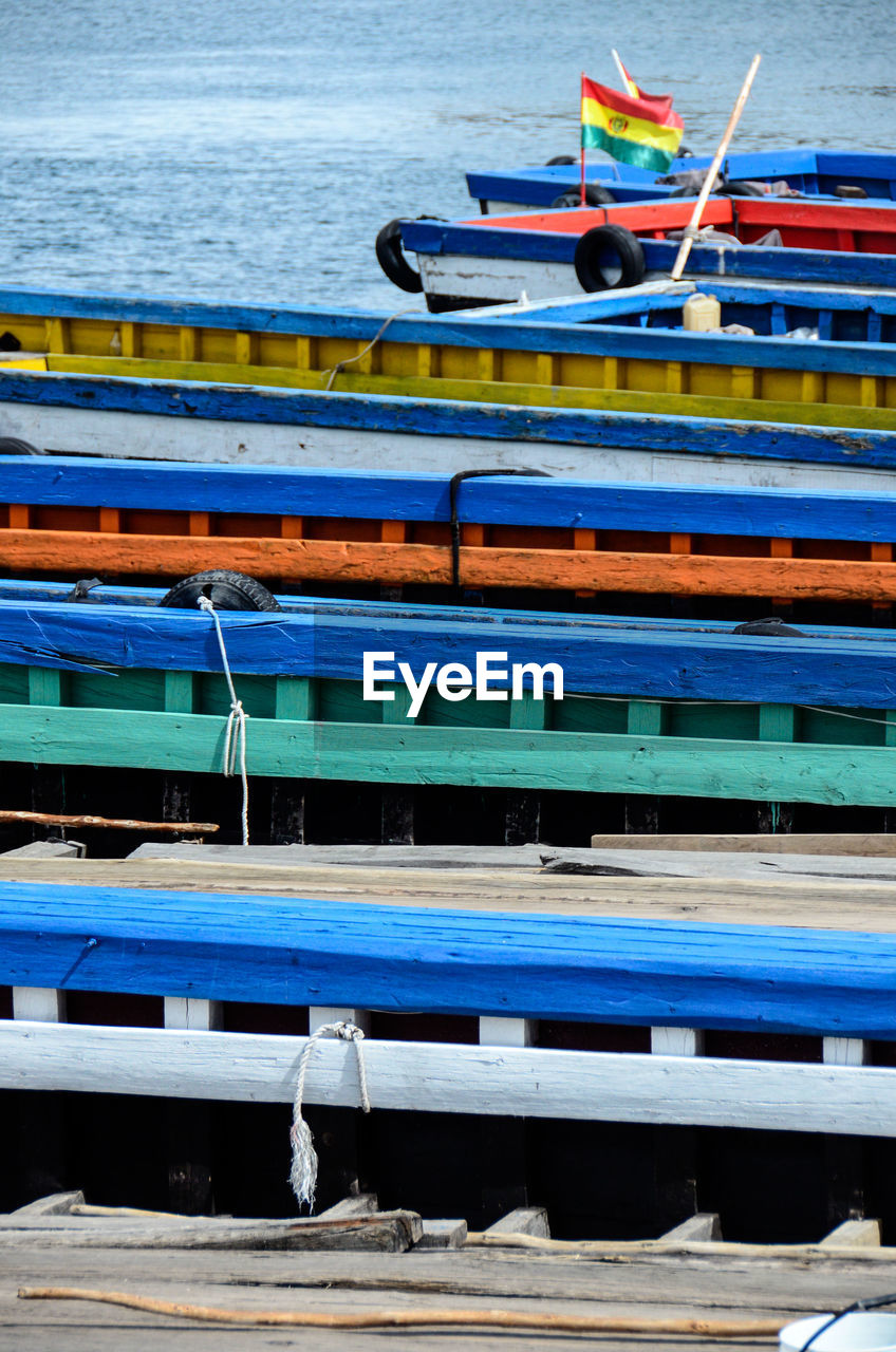 High angle view of colorful boats moored on lake