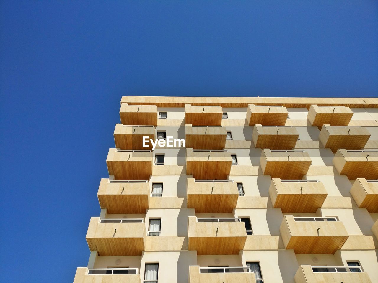 Low angle view of building against blue sky