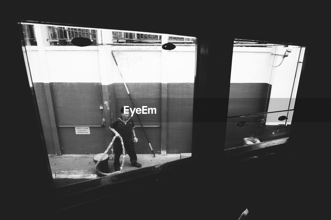 WOMAN STANDING IN BUS