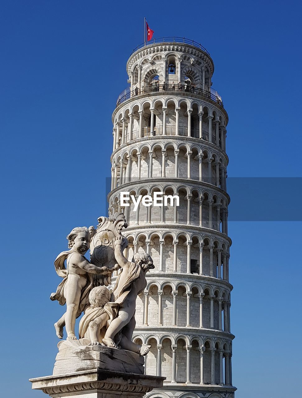 Sculptures by leaning tower of pisa