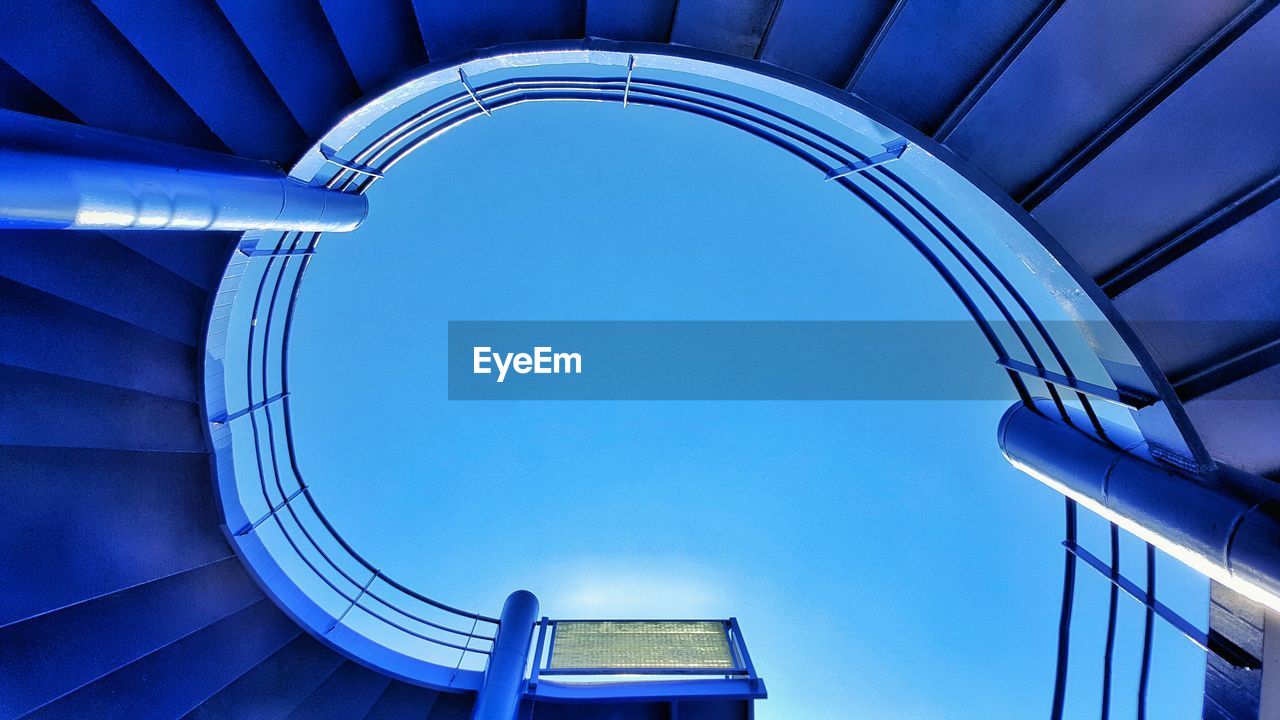 Low angle view of spiral staircase against sky