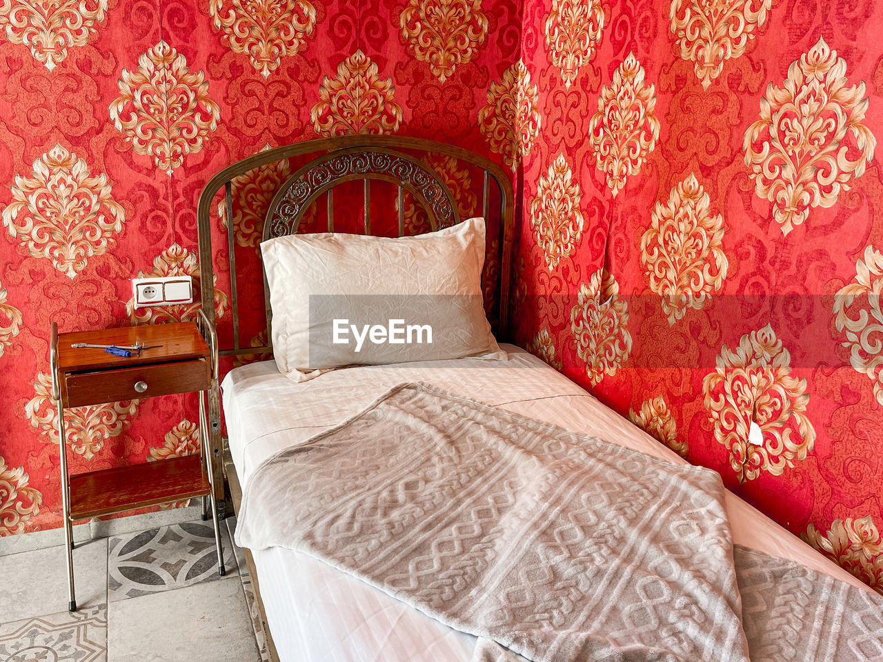 furniture, pattern, bed, pillow, red, bed sheet, indoors, bedroom, textile, no people, room, domestic room, home interior, cushion, comfortable, floral pattern, wealth, stuffed, luxury, architecture, wall - building feature, cozy, relaxation, linen, wallpaper, interior design, carpet, home showcase interior, sheet, decoration, ornate