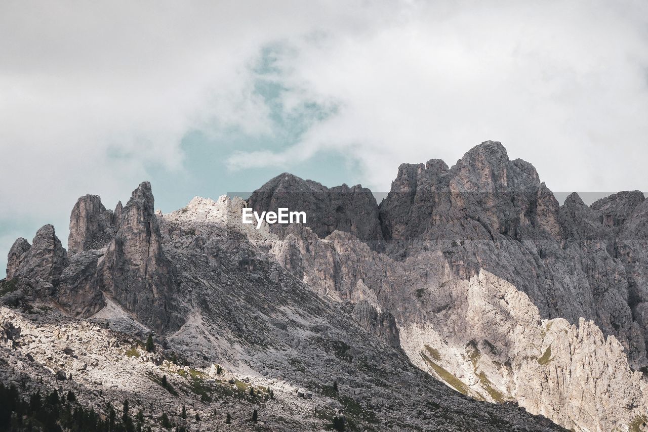 Low angle view of rock formations against sky