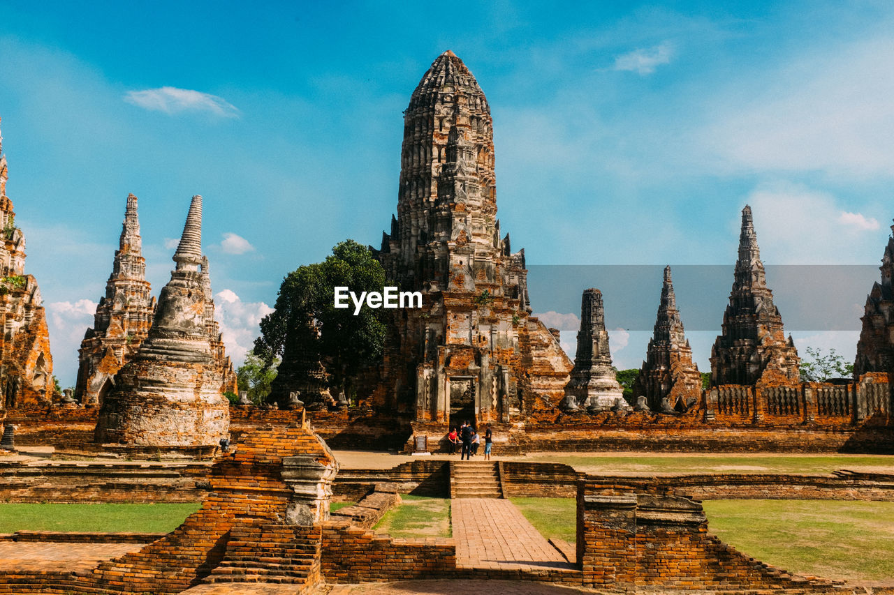 PANORAMIC VIEW OF OLD TEMPLE AGAINST BUILDINGS