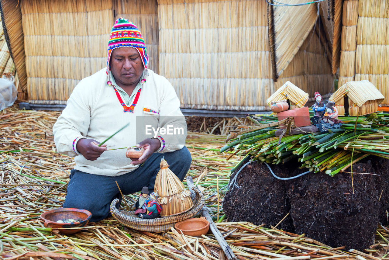 MAN WORKING WITH BASKET IN FARM